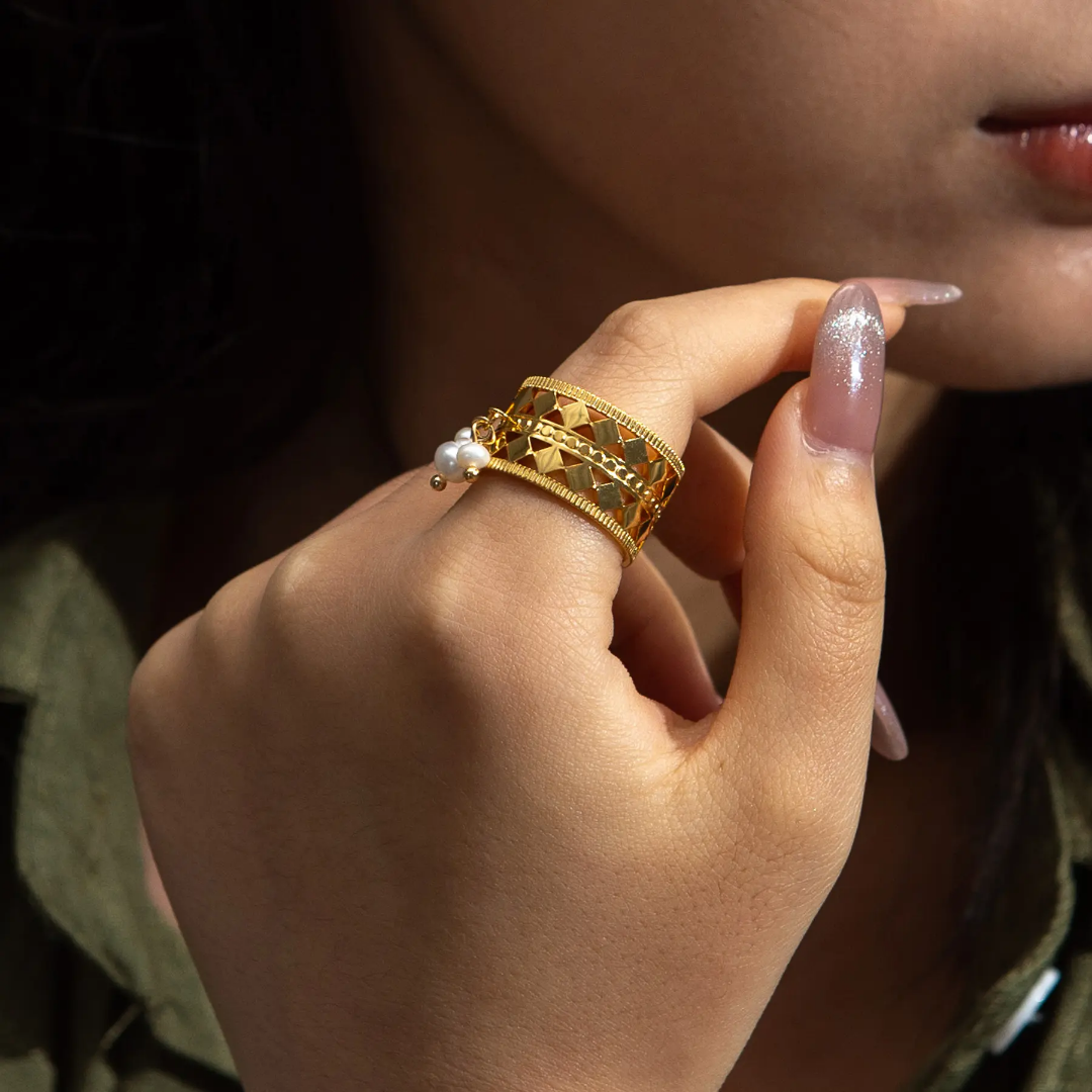 Model wearing TISA Three Pearl Royal Ring – chic abstract 18k gold plated waterproof stainless-steel ring with three pearls.