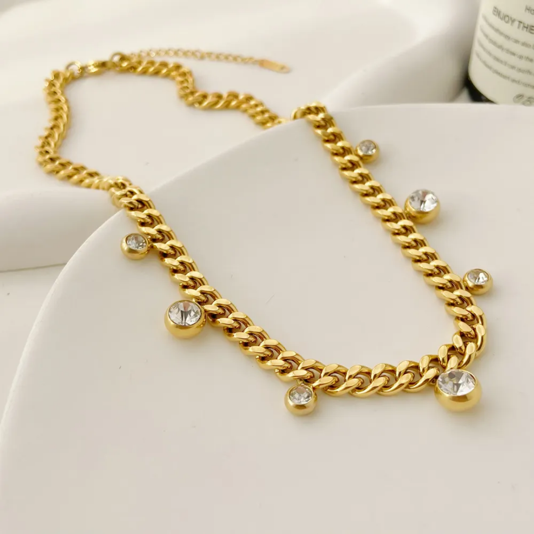 TISA Cuban Chain Necklace with Zircon Charms – stylish waterproof 18K gold-plated necklace worn for party or evening look.