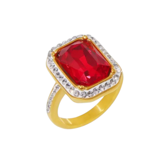 TISA Sovereign Solitaire Ring – 18K PVD gold-plated waterproof ring with red zircon centerpiece, surrounded by Czech diamonds, crafted from hypoallergenic stainless steel.
