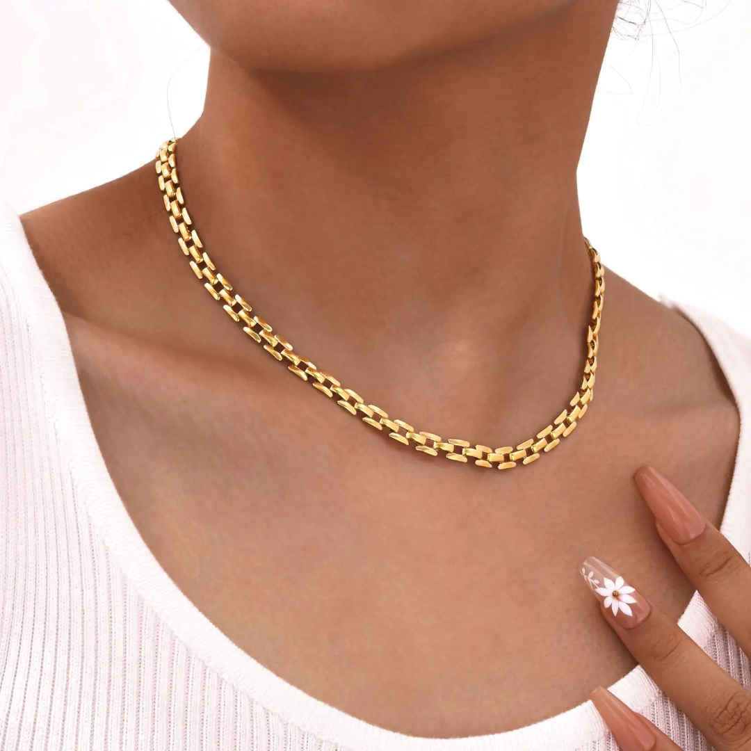 18k Gold plated chain necklace on a person with a white background