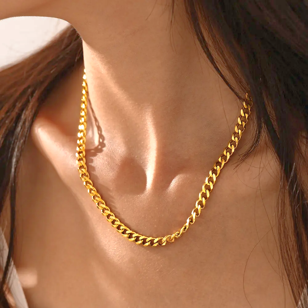 Model wearing a 18k stainless steel gold plated cuban chain.