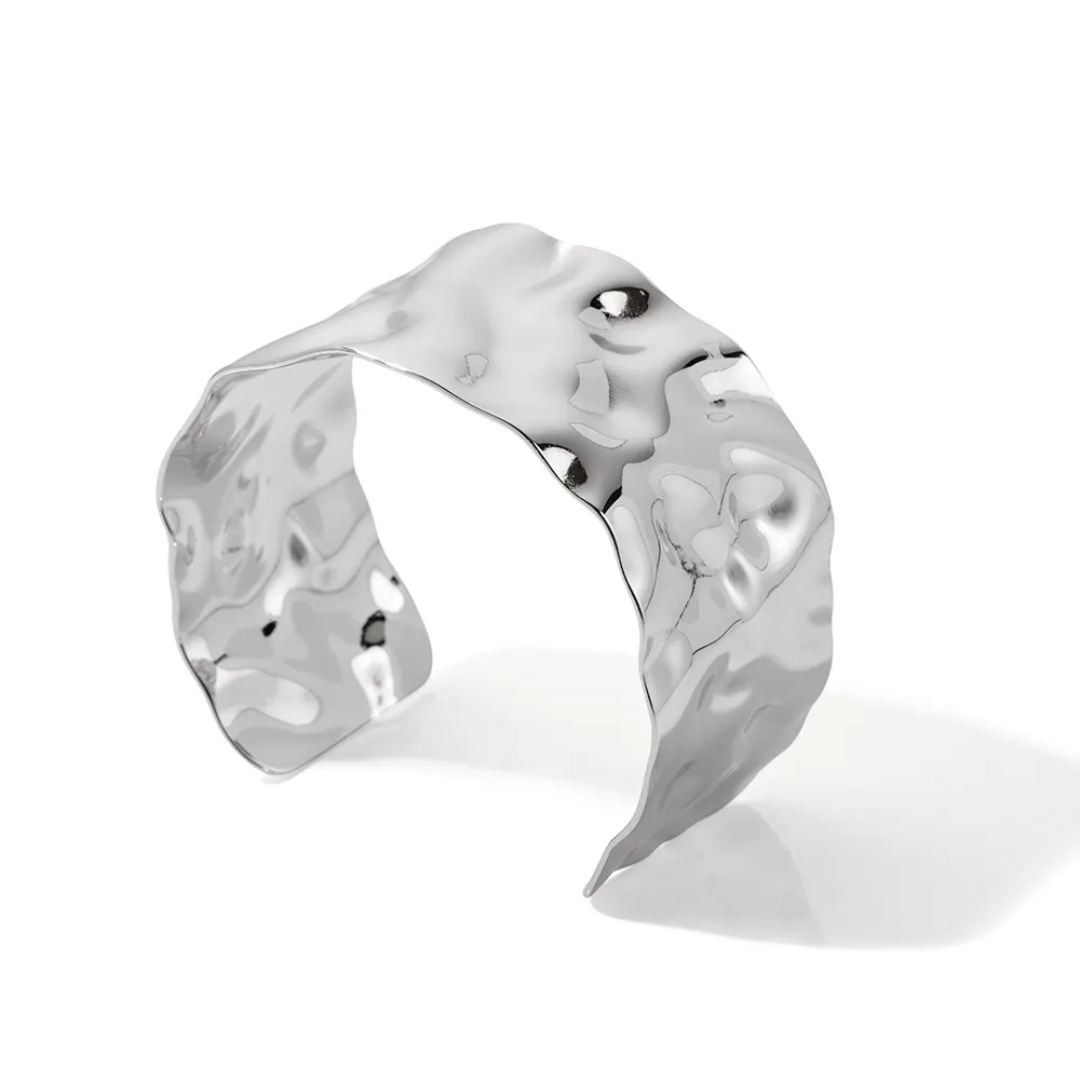 Silver hammered Cuff Bangle with a unique, organic design on a white background