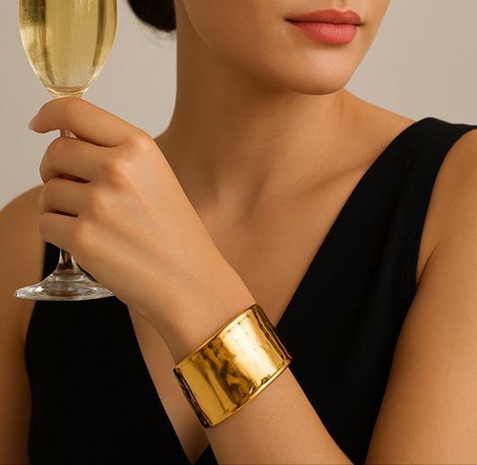 Model wearing Sol Curve Gold Bangle Cuff by TISA – sleek, polished gold cuff styled for effortless everyday elegance.