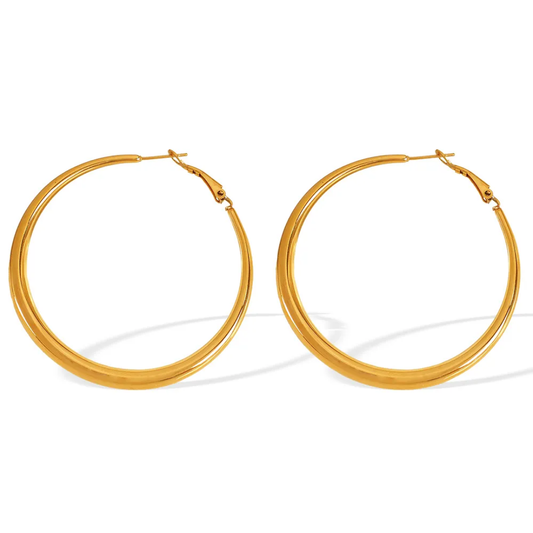 TISA Classic Gold Hoop Earrings – 18K gold-plated waterproof stainless steel hoops, hypoallergenic and tarnish-resistant with a timeless finish.