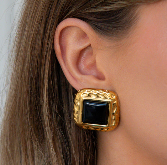 Model wearing Midnight Black Stud Earrings by TISA – elegant black agate gold studs for a bold, date-night look.