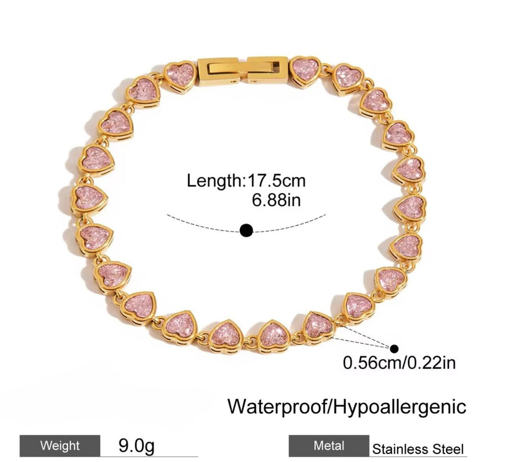 Tisa 18k Gold-plated bracelet with pink heart-shaped zircon stones on a white background with dimensions.