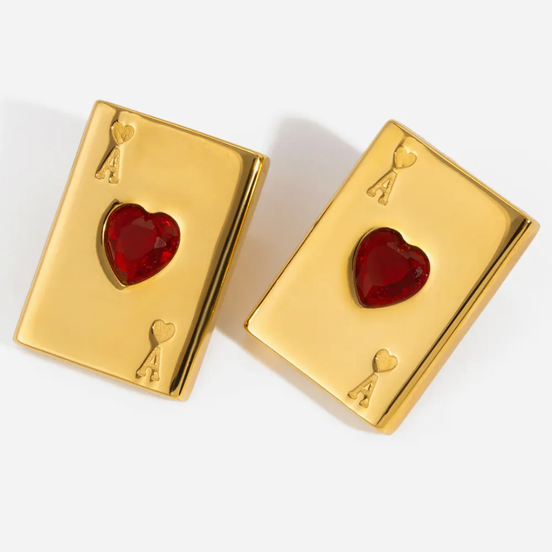 Tisa 18k Gold plated playing card-shaped poker earrings with red heart designs on a white background