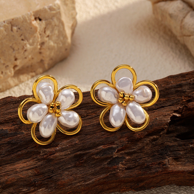 Tisa 18k gold plated Ivory Pearl Studs  kept on a wooden base.