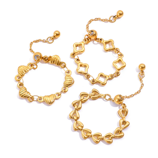 Tisa 18k Gold plated rings with various links on a white background