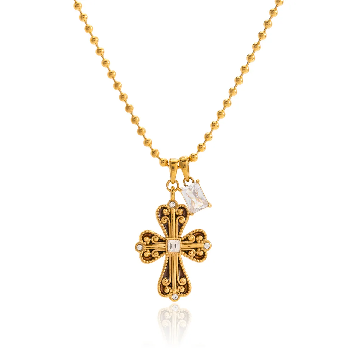 Gold necklace with a cross pendant on a white background