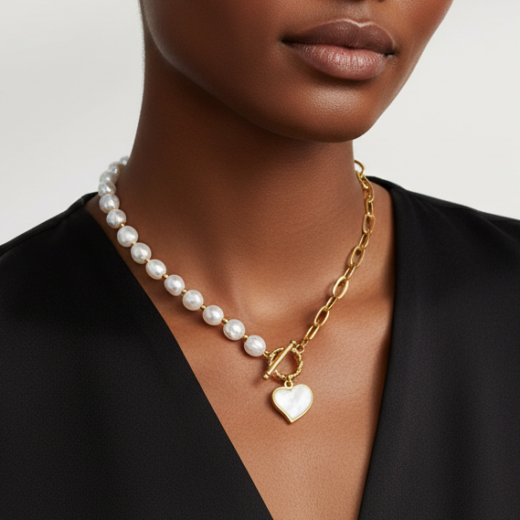 Model wearing TISA’s Pearl Beaded Necklace – elegant heart charm design with pearl beads 18k gold plated and skin-safe perfect for everyday wear.