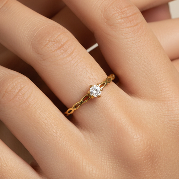 Model wearing Tisa minimalist crown ring in 18k gold plating.