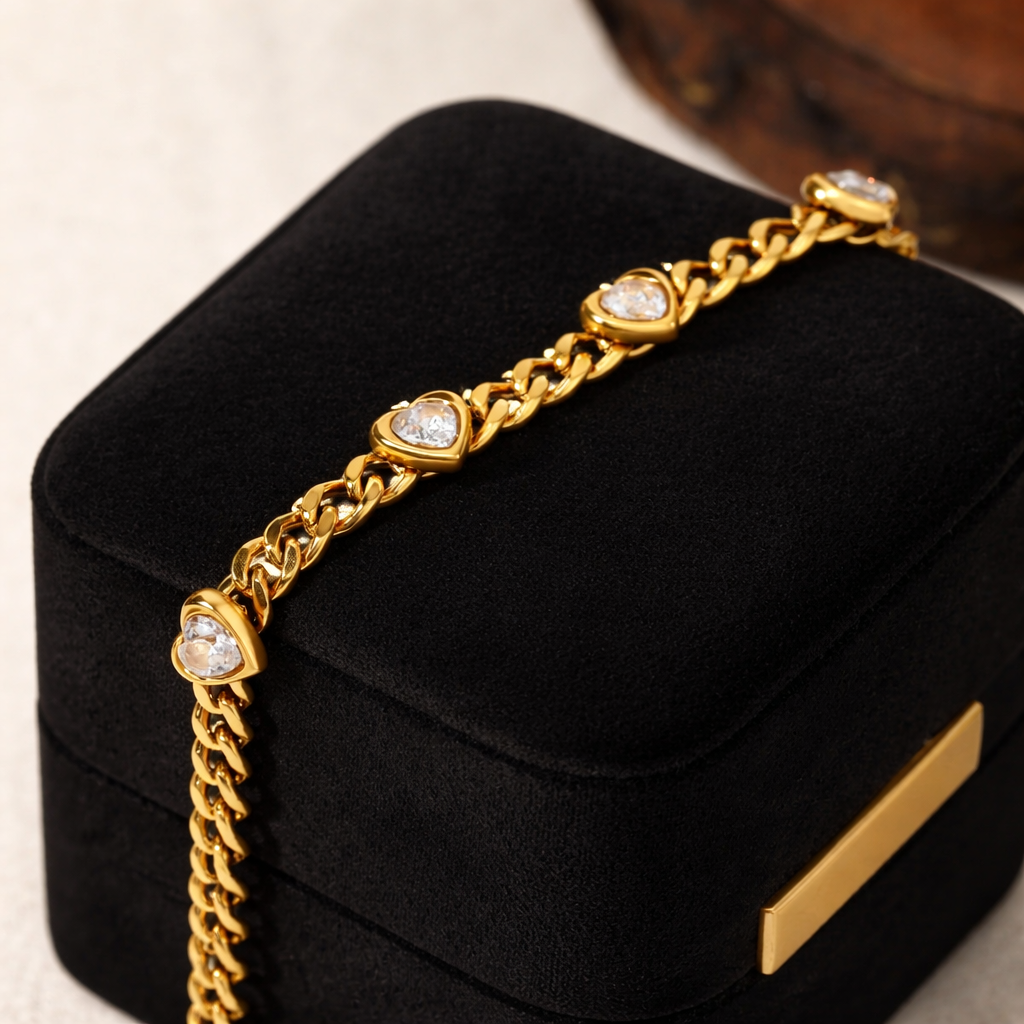 18k Gold-plated cuban chain bracelet with hearts and zircons on a black jewelry box