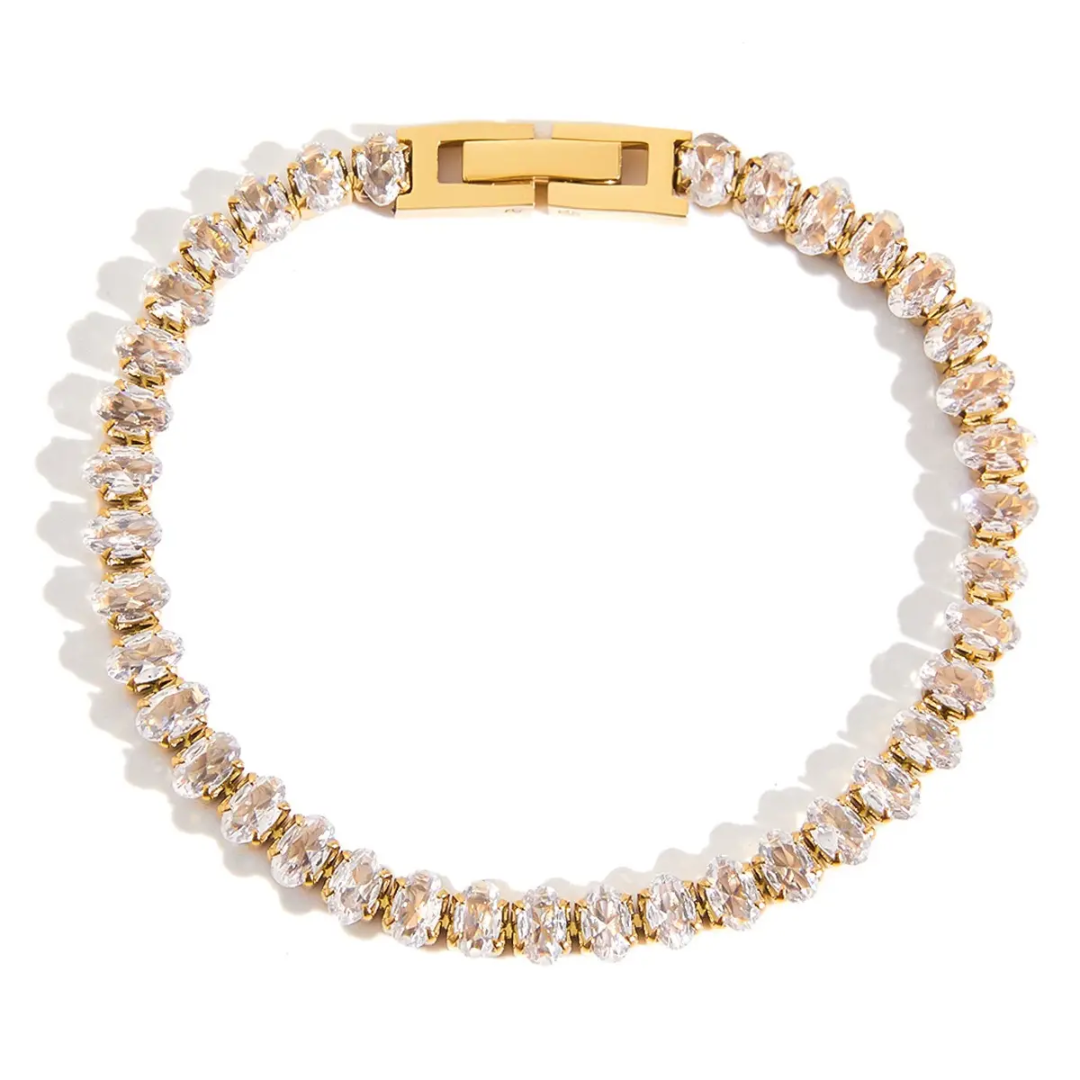 Tisa 18k Gold plated clear clear zirconia bracelet on a white background.