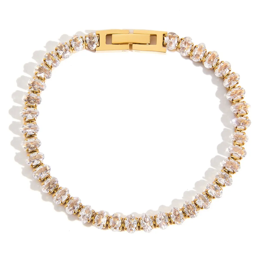 Tisa 18k Gold plated clear clear zirconia bracelet on a white background.